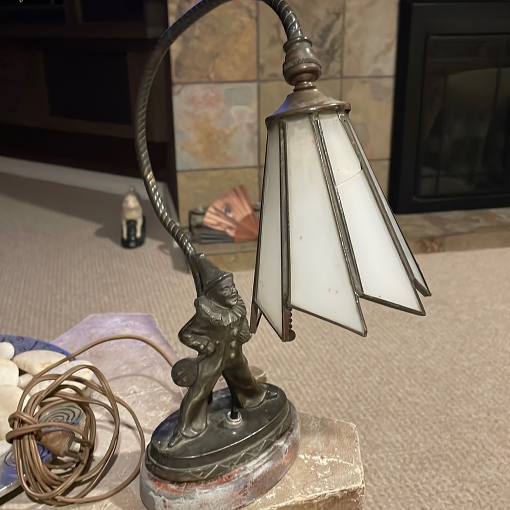 Antique lamp with clown